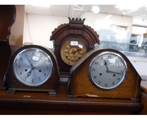 A VICTORIAN WALNUT CASED MANTEL CLOCK and two 1950s oak cased clocks (3)