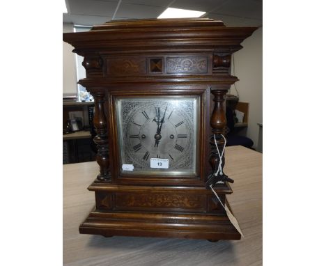 A VICTORIAN WALNUT CASED BRACKET CLOCK, by "Winterhalder & Hofmeier" with square silvered dial and a double fusee movement, 1