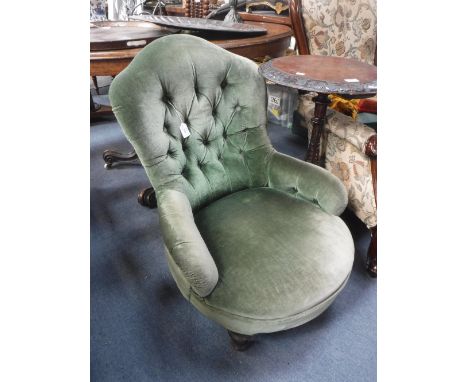 A VICTORIAN BUTTON-BACK CHAIR upholstered in green velvet