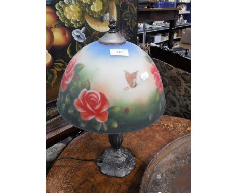 AN EDWARDIAN STYLE TABLE LAMP, with a domed glass shade decorated with roses, 48 cm high