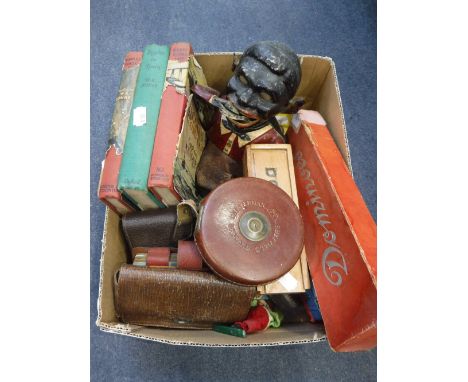 A BOX OF COLLECTABLES including a mechanical Negro money box, books, playing cards , dominoes and toy vehicles 