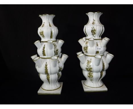 A PAIR OF CONTINENTAL CERAMIC SECTIONAL "TULIP" VASES, with individual flower sections, 37 cm high 