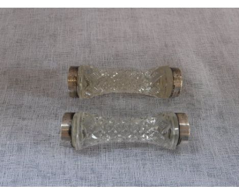 A PAIR OF CUT-GLASS AND SILVER RIMMED KNIFE AND FORK RESTS