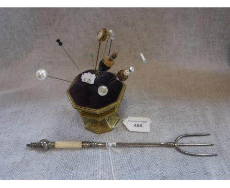 A COLLECTION OF HAT-PINS and a gilt metal tripod hat-pin stand and a toasting fork