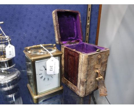 A 19TH CENTURY BRASS-CASED CARRIAGE CLOCK with repeater, "T Kirk & Co Hull", 15 cm high with leather covered case