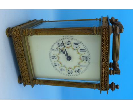 A brass and glass carriage clock, the movement marked R & Co. Made in France, top glass loose, 12.5cm