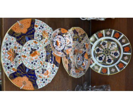 A Royal Crown Derby 1128 pattern Imari plate, two Crown Derby plates (one restored) and two Crown Derby saucers (5)