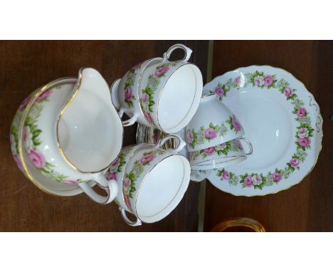 A Colclough china tea set, six cups, saucers, side plates, sugar, cream and cake plate