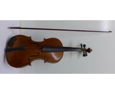A cased violin with bow, length of back excluding button 35.5cm, a/f