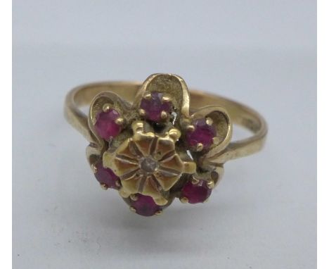 A 9ct gold, ruby and diamond 'flower' ring, 3.7g, R