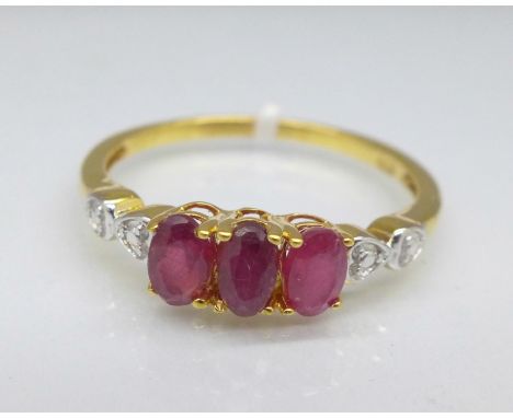 A silver gilt and ruby trilogy ring, R
