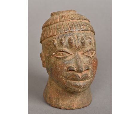 An African terracotta model of a male bust
Together with an African tribal carved wooden model of a seated woman.  The former