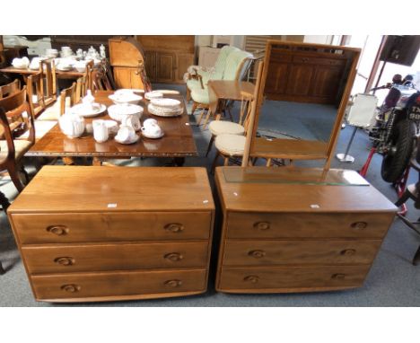 Lucian Ercolani for Ercol, an elm chest of three long drawers, raised on casters, model 412, together with a matching dressin
