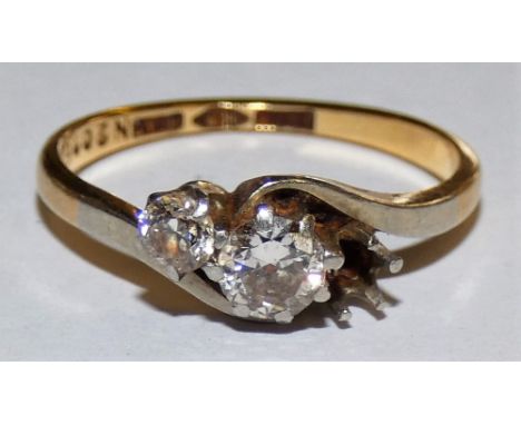 An 18 ct gold three stone diamond ring, lacking one stone