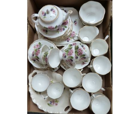 A bone china florally decorated tea service