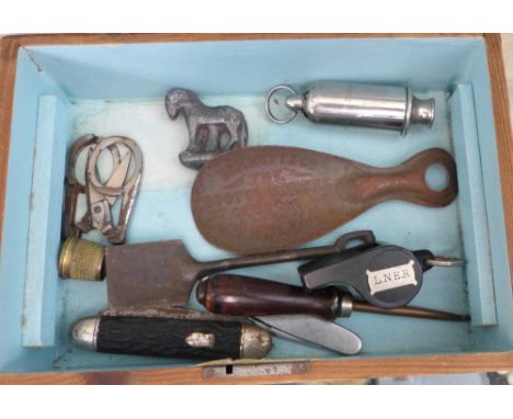 A jewellery box and contents including hat pins, badges, L.N.E.R. whistle and The ACME siren whistle, pin cushion lady with p