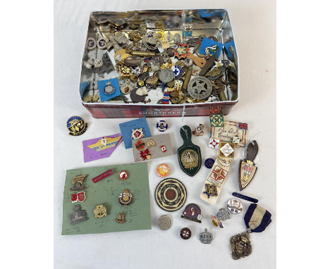 A collection of vintage metal and enamel pin and lapel badges. To include Quilter Guild, Royal National Lifeboats, Boy scouts