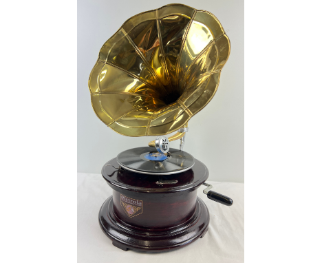 A reproduction wooden cased table top, wind up, trumpet gramophone marked "Victrola", with circular shaped base. Comes with n