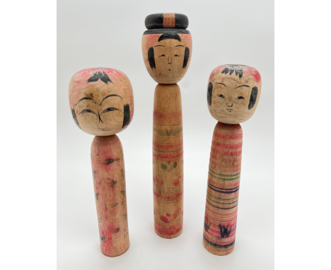 3 vintage wooden hand painted Japanese Kokeshi dolls. With hand painted signature marks to underside. Tallest approx. 24cm. 