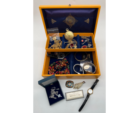 A vintage yellow coloured jewellery box and contents, to include costume jewellery & watches. Lot includes rabbits foot brooc