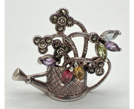 A vintage silver brooch modelled as a watering can, set with marquis cut gemstones and marcasite's. Stamped 925 to reverse an