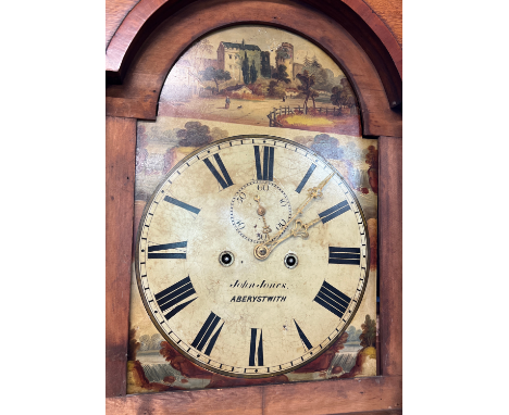 An antique fruit wood long case clock by John Jones Aberystwyth, Wales. Hand painted face with village and waterfall detail a