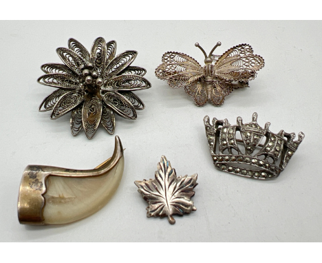 5 vintage silver and white metal vintage brooches to include a filigree butterfly with safety chain, a marcasite set crown br
