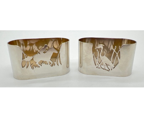 2 vintage silver Garrard &amp; Co novelty napkin rings with cut out details of country scenes. A heron - hallmarked for Sheff