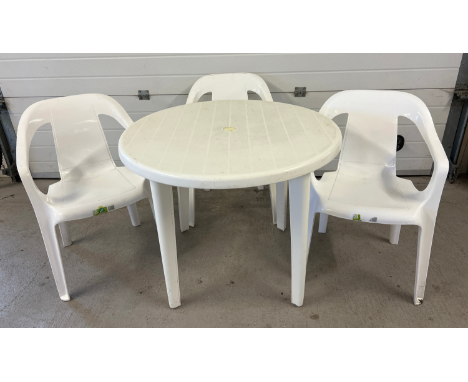 A white plastic circular garden table and 3 Keter chairs. Chairs stack and table legs are removable for easy storage. 