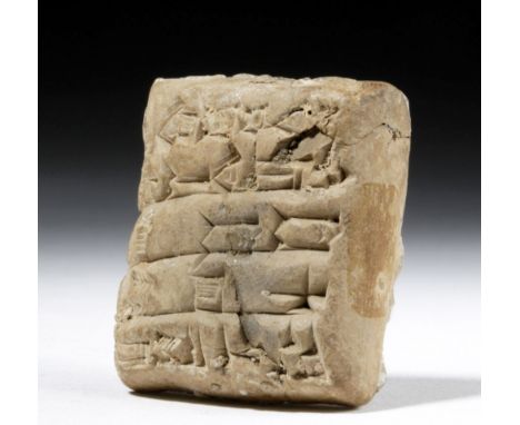 Ancient Near East, Ur III, ca. 2112 to 2004 BCE. A clay "biscuit" with cuneiform writing. Cuneiform script is one of the olde