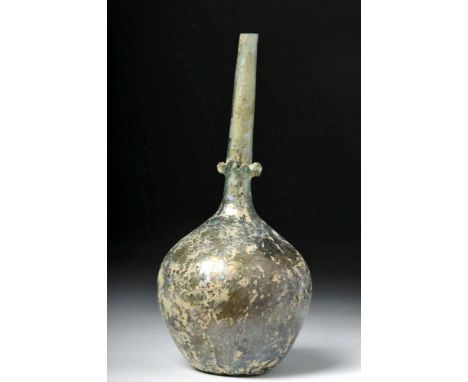 Rome, ca. 3rd to 4th century CE. In a compound word, jaw-dropping! A free-blown glass bottle of light blue-green hues with a 