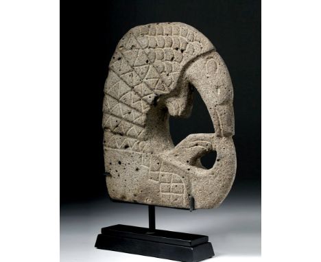 Pre-Columbian, Mayan territories, ca. 500 to 950 CE. A magnificent example of a ceremonial hacha depicting an armadillo, hand