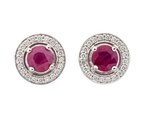 A pair of ruby and diamond 18ct white gold target studs, each comprising a round ruby claw set to the centre approx 5.5mm, wi