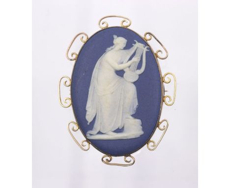 A late Victorian/early Edwardian Wedgwood blue jasperware cameo brooch, depicting a classical maiden playing a lyre, approx 4