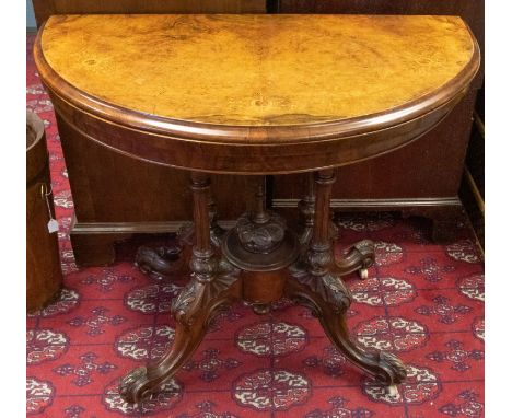 A mid Victorian mahogany and walnut card table, half round with walnut top and inlaid detail, lift up to reveal green velvet 