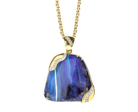 An opal and diamond set 14ct gold pendant, comprising an organic shaped boulder opal with blue coloration, two corners set wi