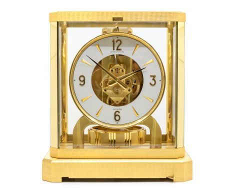 Jeager LeCoultre- an gilt brass 'Atmos' clock by Jaeger LeCoultre, (1970-1999) white lacquered dial with applied gilt arrow a
