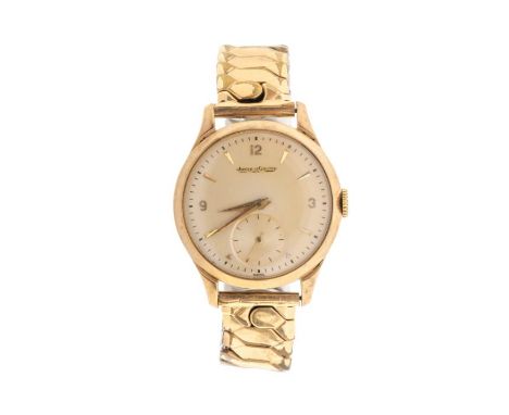 A Jaeger LeCoultre gentleman's 9ct gold automatic wristwatch, circa 1950/60's, round champagne dial  with applied arrow and n