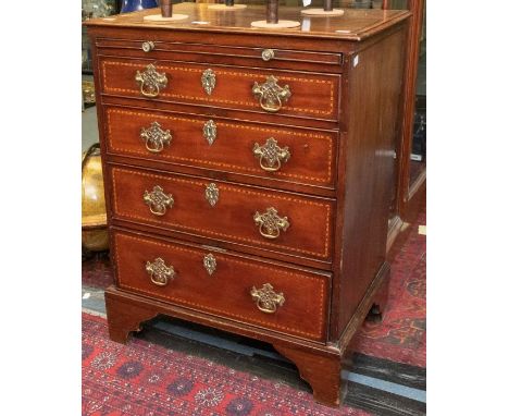 A George II inlaid mahogany small chest of drawers, on bracket feet, inlaid top and drawer fronts, vanity pull out top shelf 