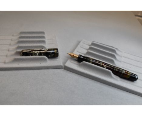 A Parker Vacumatic button fill fountain pen in grey, red and pearl marble with two narrow bands to the cap having a Parker 14