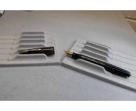 A Parker Vacumatic button fill fountain pen in grey tansparant striated with two narrow bands to the cap having a Parker 14k 