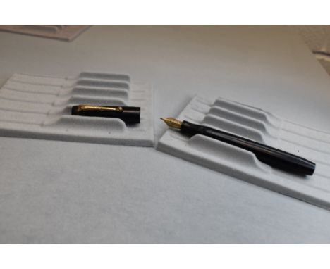 A Parker Victory button fill fountain pen in black no bands to cap having Parker N nib. Approx 12.8cm