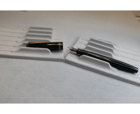 A Parker Victory button fill fountain pen in dark green with two narrow bands to the cap having a Parker 20 8 nib. Approx 13.