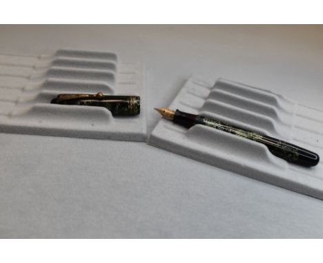 A Parker Televisor button fill fountain pen in green and black hatch with three narrow bands to cap having a Parker 5 nib. Ap