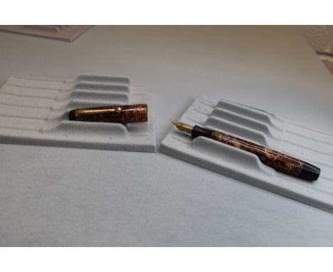 A Parker Valentine/ Victory button fill fountain pen in brown hatch with no bands to cap and having a Parker 25 nib. Approx 1