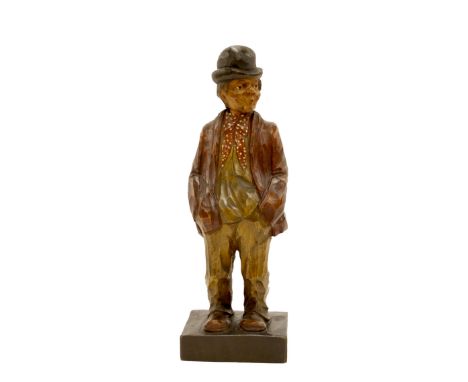 Antique style scratch carved Black Forest whistling automaton modelled as a peasant wearing a bowler hat, key wind mechanism,