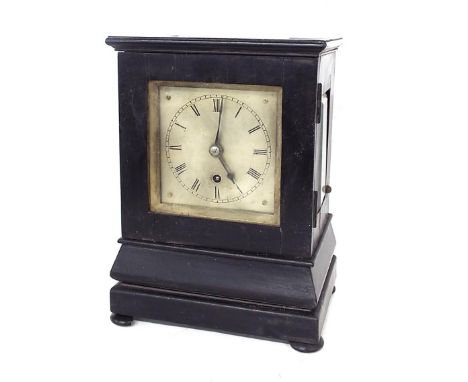 English ebonised single fusee mantel clock, the movement back plate with circular aperture revealing visible wheel work and w