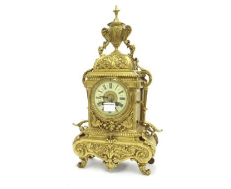 Brass two train mantel clock, the A.D. Mougin movement with outside countwheel and striking on a bell, the 3.5" dial within a