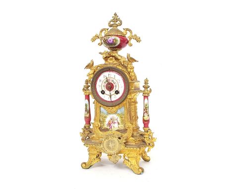 French spelter and porcelain mounted two train mantel clock, the Mougin movement striking on a bell, the 3" porcelain painted