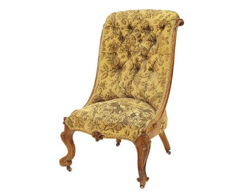 Victorian spoon back salon chair with button-back floral upholstery and walnut frame, on cabriole front legs, 37" high (at fa